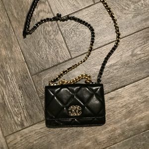 Chanel flap bag dupe. Authentic leather, beautiful purse. Heavy, nice chain.
